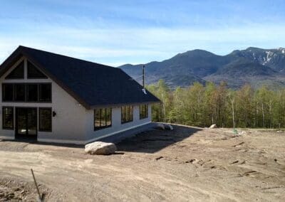 Exterior view of art barn with White Mountains behind