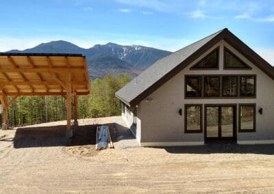 Exterior view of modern style barn with solar panel next to it