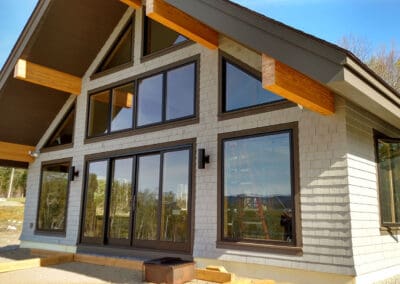 Exterior front view of modern style barn with glulam beams