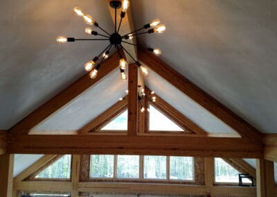 timber frame and lighting fixture in the Modern Art Barn