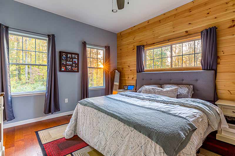 master bedroom with tongue and groove wall 