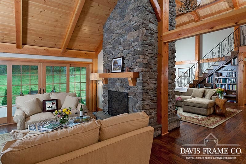 timber frame great room and living room with double sided fireplace 