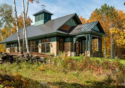 Exterior view of Vermont Natatorium with green trim and cupola