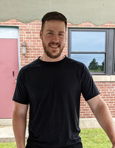 Man standing in front of Plains Road office